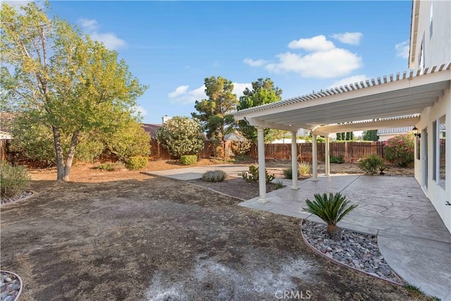 2892 Chuckwagon Rd, Palmdale, CA 93550 - fenced backyard featuring a patio area and a pergola