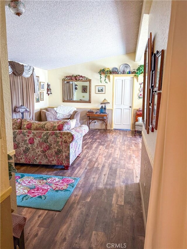27545 Jasper Way, Castaic, CA 91384 - living room with wood finished floors, a textured ceiling, and lofted ceiling