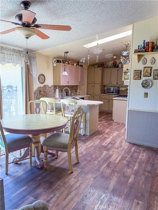 27545 Jasper Way, Castaic, CA 91384 - dining area with a textured wall, dark wood finished floors, a textured ceiling, and a ceiling fan