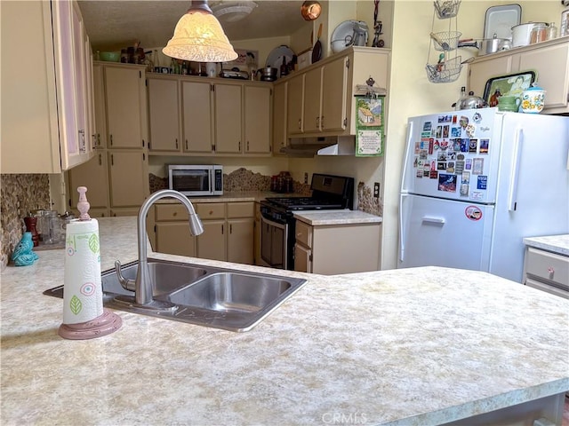 27545 Jasper Way, Castaic, CA 91384 - kitchen with freestanding refrigerator, gas range, light countertops, and stainless steel microwave