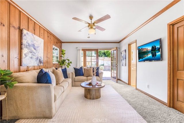 695 W 13th St, Upland, CA 91786 - living area with crown molding, a ceiling fan, carpet floors, and wooden walls