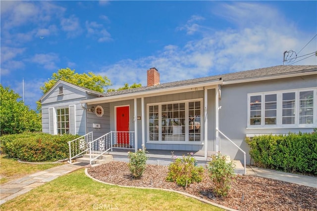 695 W 13th St, Upland, CA 91786 - single story home with a chimney, a front yard, and covered porch
