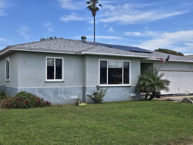 835 Corvina St, Imperial Beach, CA 91932 - view of home's exterior with a shingled roof, a yard, roof mounted solar panels, and stucco siding
