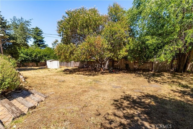 4955 Arizona Ave, Atascadero, CA 93422 - fenced backyard with a storage unit
