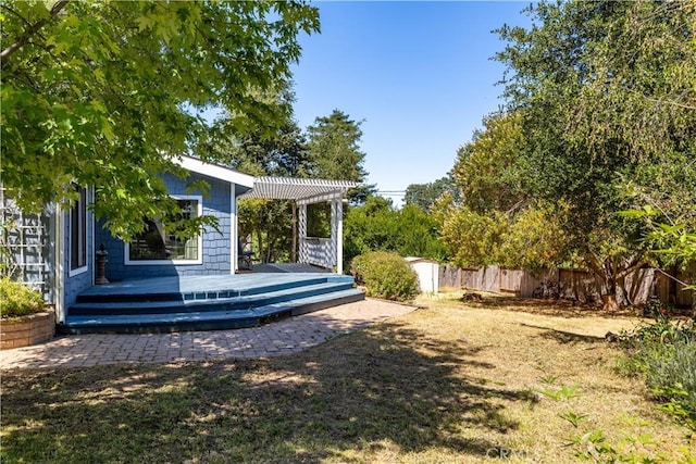4955 Arizona Ave, Atascadero, CA 93422 - fenced backyard featuring a pergola, a deck, and a storage unit