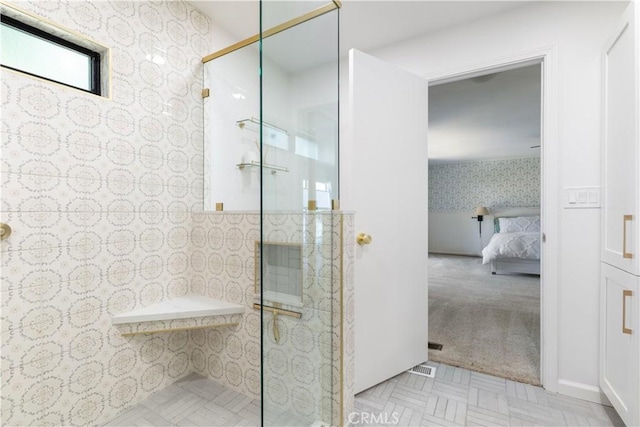 4955 Arizona Ave, Atascadero, CA 93422 - ensuite bathroom with wallpapered walls, a walk in shower, wainscoting, and tile walls