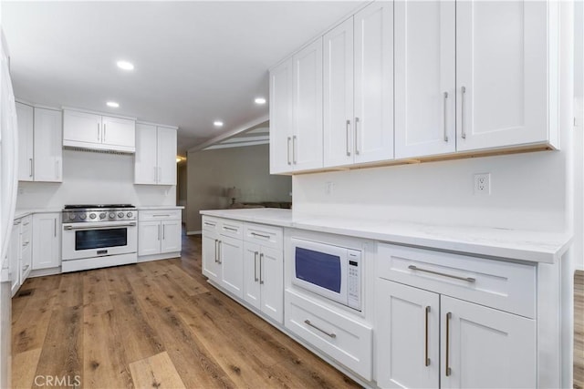 4955 Arizona Ave, Atascadero, CA 93422 - kitchen featuring stainless steel range, white microwave, white cabinets, recessed lighting, and light stone counters