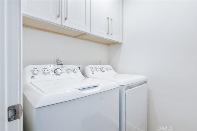4955 Arizona Ave, Atascadero, CA 93422 - laundry area featuring washer and clothes dryer and cabinet space