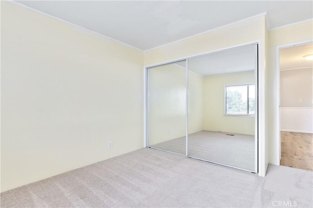 4955 Arizona Ave, Atascadero, CA 93422 - unfurnished bedroom featuring carpet flooring, ornamental molding, and a closet