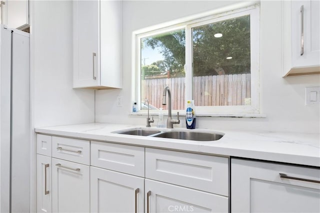 4955 Arizona Ave, Atascadero, CA 93422 - kitchen featuring stainless steel fridge, dishwasher, white cabinets, and light stone countertops