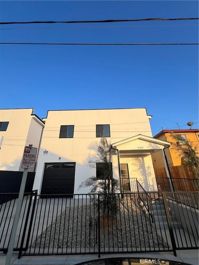 4264 Capistrano Way E, Los Angeles, CA 90063 - modern home with a fenced front yard and stucco siding