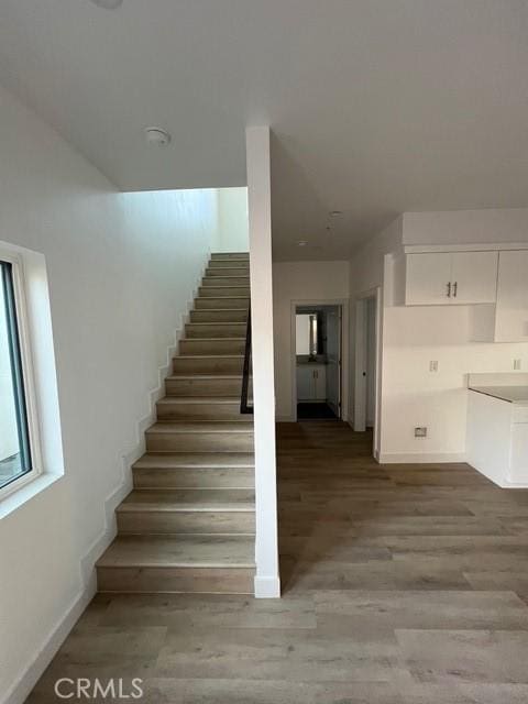 1217 E 22nd St, Los Angeles, CA 90011 - stairway with wood finished floors and baseboards