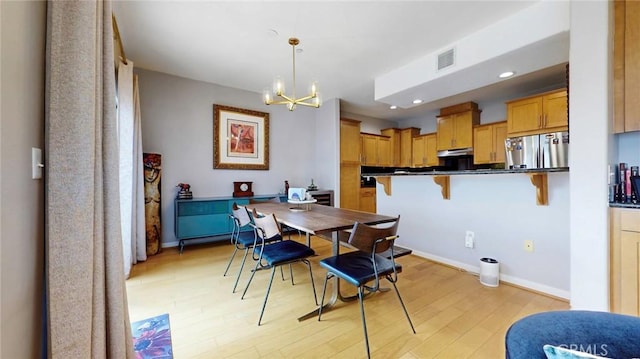 4821 Bakman Ave Unit 405, North Hollywood, CA 91601 - dining area featuring a chandelier, light wood-style floors, and recessed lighting