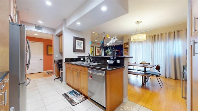 4821 Bakman Ave Unit 405, North Hollywood, CA 91601 - kitchen featuring stainless steel appliances, hanging light fixtures, recessed lighting, and light tile patterned floors