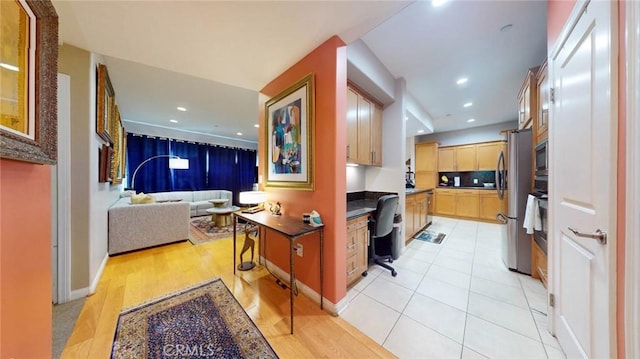 4821 Bakman Ave Unit 405, North Hollywood, CA 91601 - kitchen featuring stainless steel appliances, built in study area, open floor plan, dark countertops, and recessed lighting