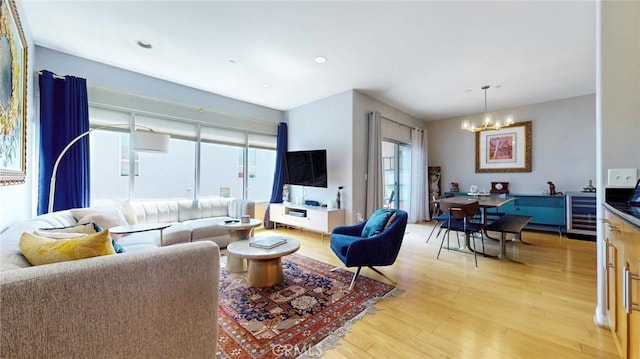 4821 Bakman Ave Unit 405, North Hollywood, CA 91601 - living area with a chandelier, light wood-style floors, beverage cooler, and recessed lighting