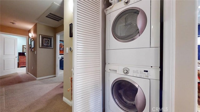 4821 Bakman Ave Unit 405, North Hollywood, CA 91601 - laundry room featuring stacked washing machine and dryer and carpet