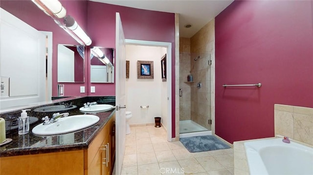 4821 Bakman Ave Unit 405, North Hollywood, CA 91601 - bathroom featuring a shower stall, double vanity, a bath, and tile patterned floors
