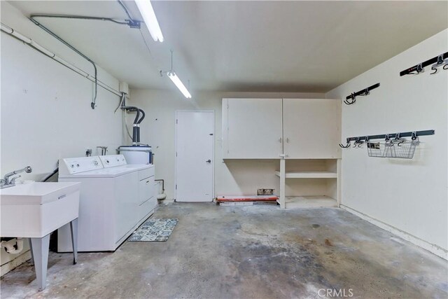 3463 Bahia Blanca W Unit B, Laguna Woods, CA 92637 - garage with washing machine and dryer and a sink