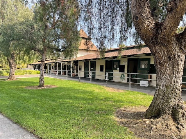 3463 Bahia Blanca W Unit B, Laguna Woods, CA 92637 - view of front facade featuring an exterior structure and roof with shingles