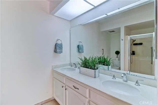 3463 Bahia Blanca W Unit B, Laguna Woods, CA 92637 - bathroom featuring double vanity and a stall shower
