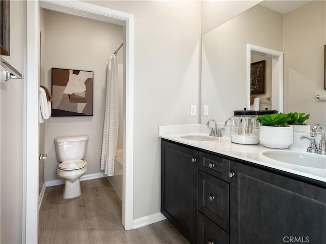 7176 Squall Dr, Riverside, CA 92522 - bathroom featuring wood finished floors, double vanity, and shower / bathtub combination with curtain
