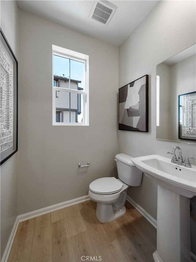 7176 Squall Dr, Riverside, CA 92522 - bathroom featuring toilet and wood finished floors