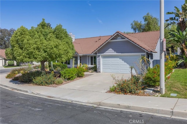 24538 Meadow Grass Way, Moreno Valley, CA 92557 - ranch-style home with a tile roof, an attached garage, concrete driveway, and a chimney
