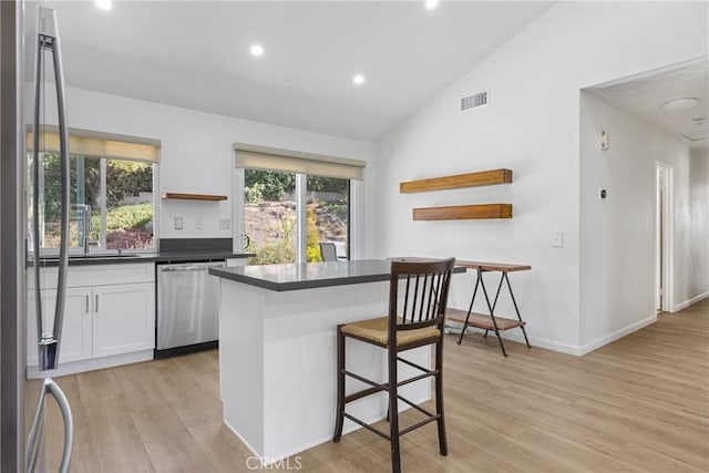 24538 Meadow Grass Way, Moreno Valley, CA 92557 - kitchen with open shelves, dishwasher, dark countertops, light wood-style flooring, and recessed lighting