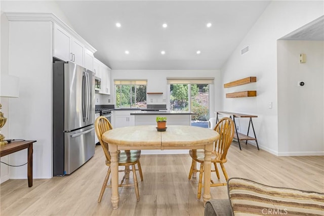 24538 Meadow Grass Way, Moreno Valley, CA 92557 - dining room with light wood-style flooring, recessed lighting, and lofted ceiling