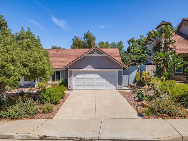 24538 Meadow Grass Way, Moreno Valley, CA 92557 - view of front of property featuring a tiled roof, a garage, and driveway