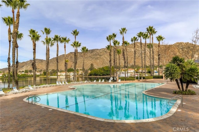 24538 Meadow Grass Way, Moreno Valley, CA 92557 - community pool featuring a mountain view and a patio