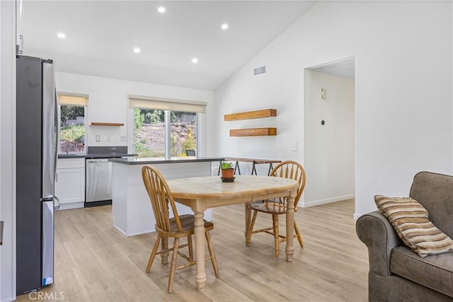 24538 Meadow Grass Way, Moreno Valley, CA 92557 - dining room featuring light wood-style flooring, high vaulted ceiling, and recessed lighting