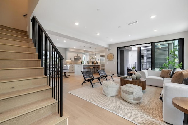 3586 Garfield St, Carlsbad, CA 92008 - living area featuring recessed lighting, plenty of natural light, stairway, and light wood-style flooring