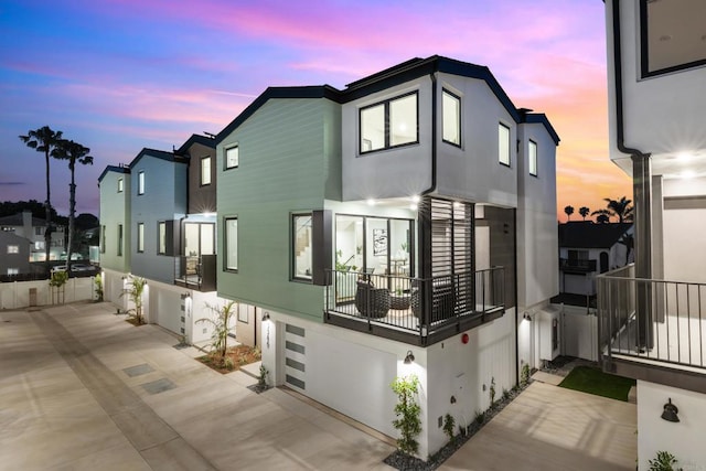3586 Garfield St, Carlsbad, CA 92008 - property exterior at dusk featuring stucco siding and an attached garage
