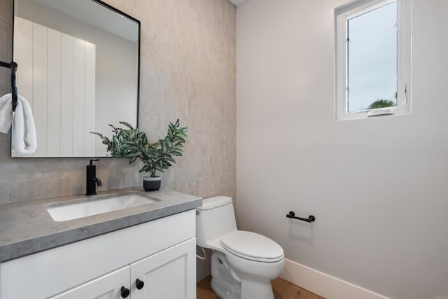 3586 Garfield St, Carlsbad, CA 92008 - bathroom with vanity, tile walls, wood finished floors, and tasteful backsplash