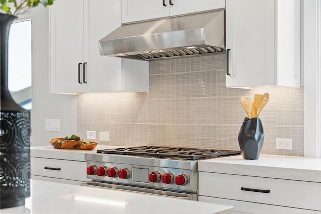 3586 Garfield St, Carlsbad, CA 92008 - kitchen with ventilation hood, stainless steel range, white cabinets, and light countertops