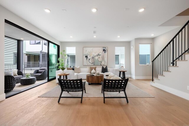 3586 Garfield St, Carlsbad, CA 92008 - living area featuring light wood-style floors, stairway, and recessed lighting