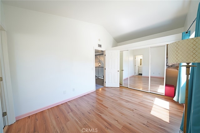 20004 Kent Ln, Canyon Country, CA 91351 - unfurnished bedroom featuring vaulted ceiling, light wood-style floors, and a closet