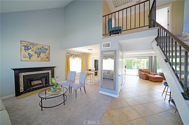 20004 Kent Ln, Canyon Country, CA 91351 - tiled living room with stairway, a towering ceiling, plenty of natural light, and a fireplace