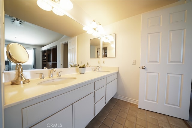 20004 Kent Ln, Canyon Country, CA 91351 - full bath with double vanity, tile patterned flooring, and a ceiling fan