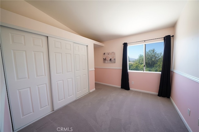 20004 Kent Ln, Canyon Country, CA 91351 - unfurnished bedroom featuring a closet, lofted ceiling, and carpet flooring