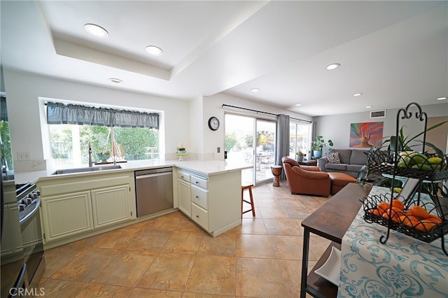 20004 Kent Ln, Canyon Country, CA 91351 - kitchen featuring appliances with stainless steel finishes, a peninsula, light countertops, recessed lighting, and open floor plan