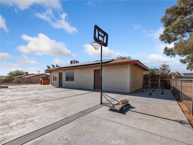 17789 Sycamore St, Hesperia, CA 92345 - back of property featuring roof mounted solar panels, a patio, and a fenced backyard