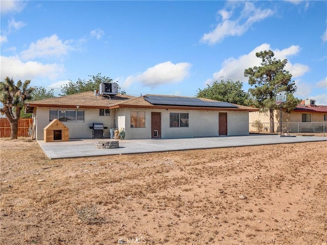 17789 Sycamore St, Hesperia, CA 92345 - rear view of property featuring a patio area, roof mounted solar panels, and stucco siding