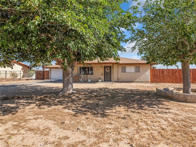 17789 Sycamore St, Hesperia, CA 92345 - view of front of property featuring a garage, stucco siding, and driveway