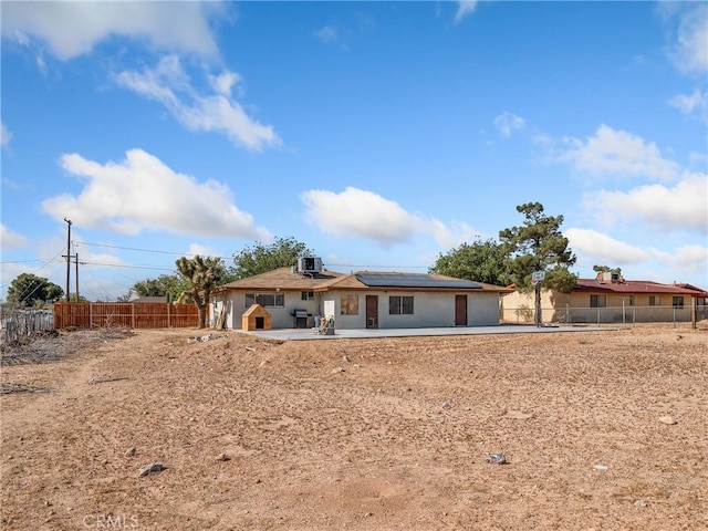 17789 Sycamore St, Hesperia, CA 92345 - view of front facade featuring solar panels and a patio