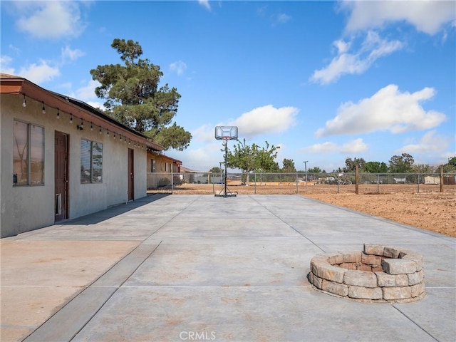 17789 Sycamore St, Hesperia, CA 92345 - view of patio featuring a fire pit