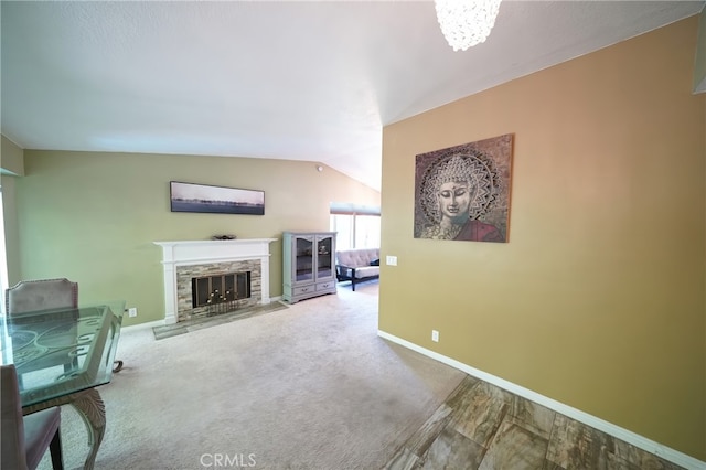 27768 Crookshank Dr, Saugus, CA 91350 - living room with a fireplace, vaulted ceiling, and carpet flooring