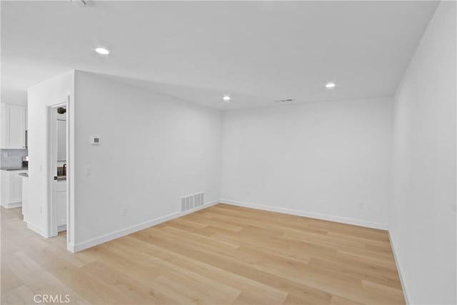 22983 Via Cereza Unit 3B, Mission Viejo, CA 92691 - unfurnished room featuring light wood-style floors and recessed lighting